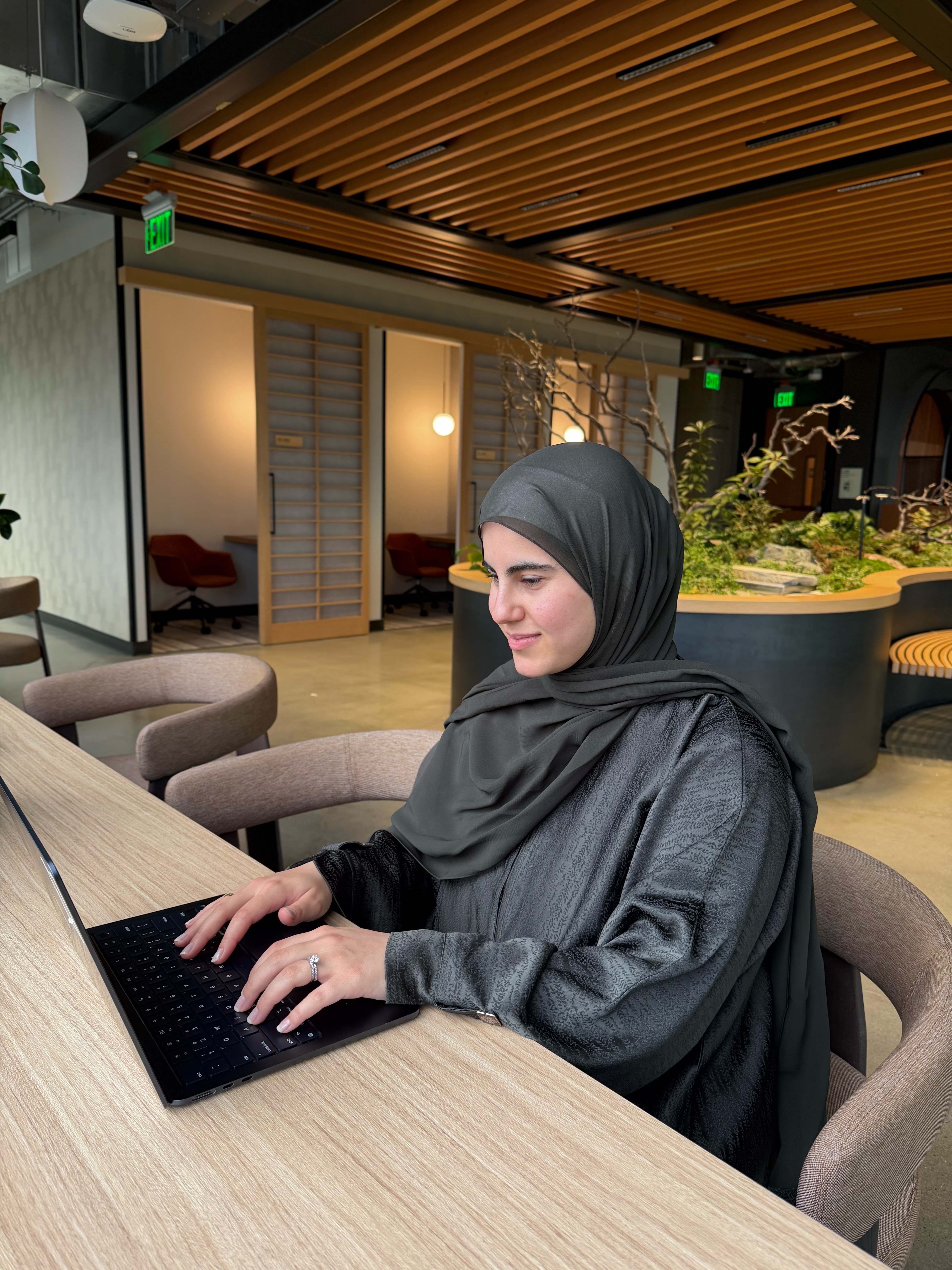 Hiba working at a table